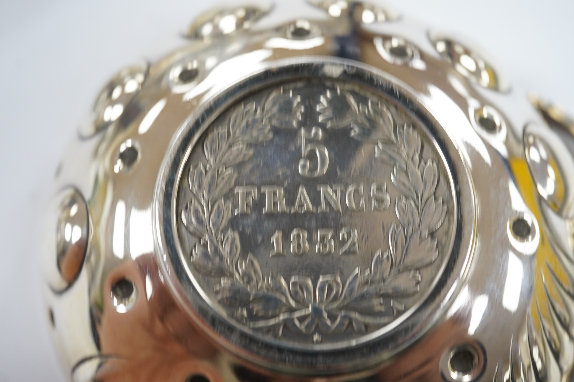 Small silver including a napkin ring, hand mirror and two mounted glass toilet jars, together with three Indian white metal condiments and a French white metal wine taster. Condition - poor to fair